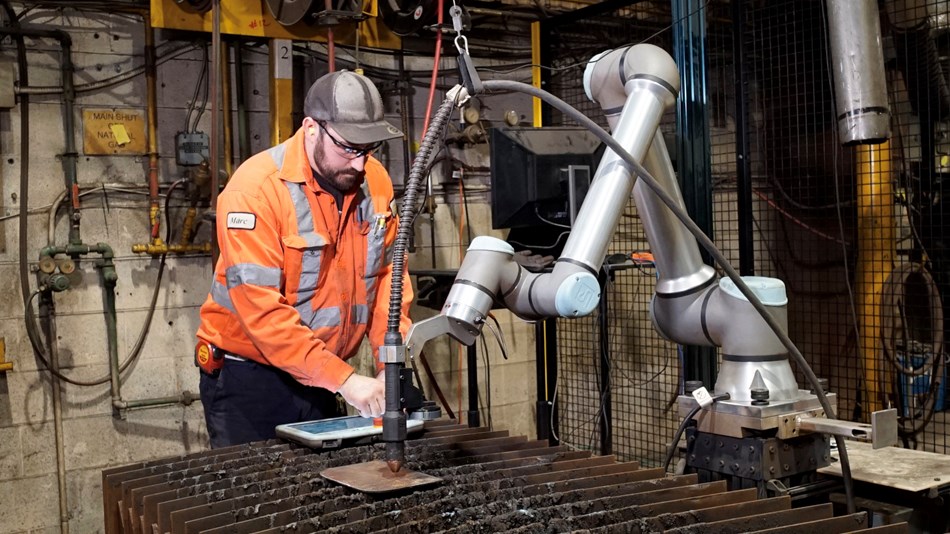 Marc Sauve operates the plasma-cutting robot with no prior robotics experience